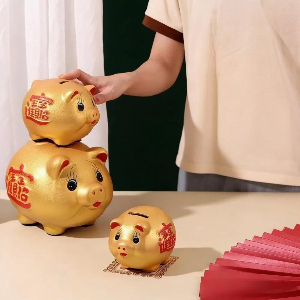 Tirelire enfant cochon dorée